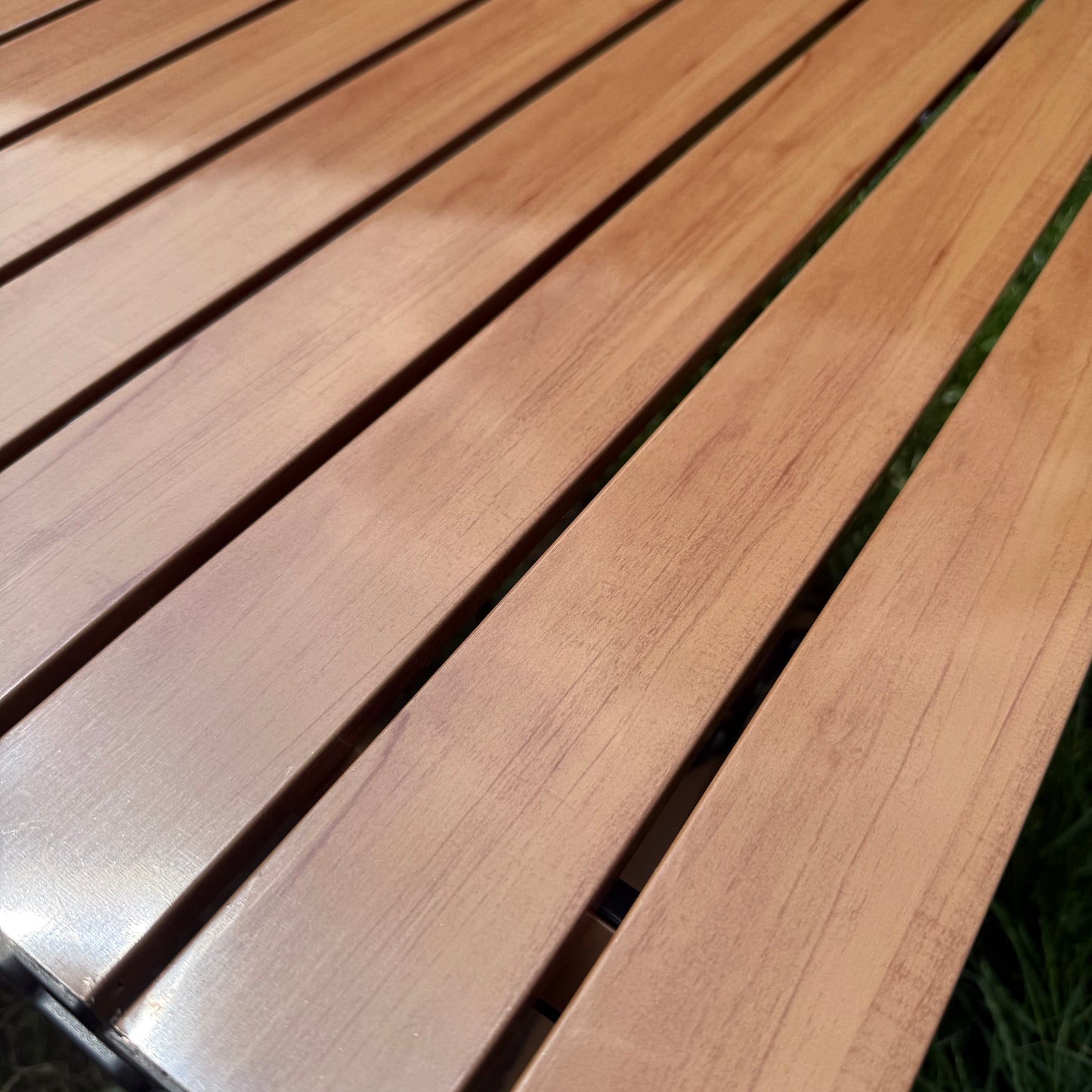 Ultra Ultra Light folding table with a Beech wood grain effect top