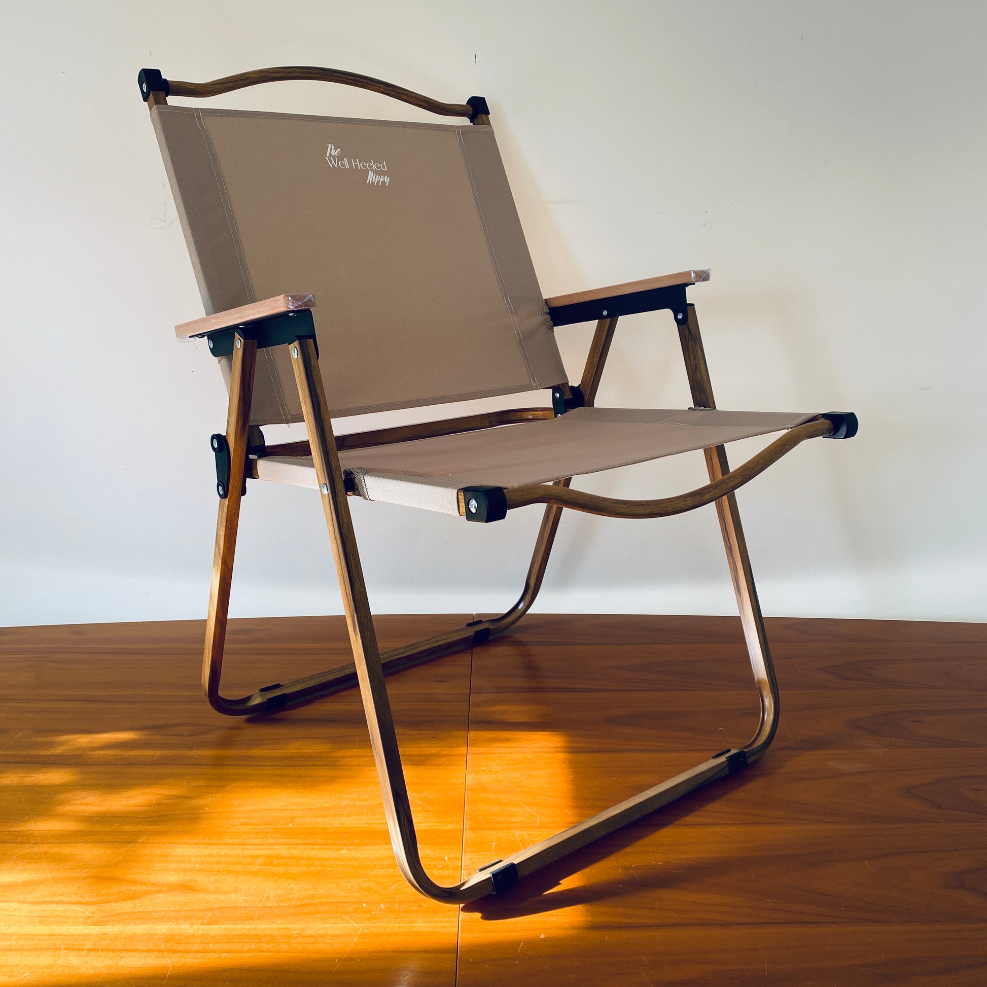 A foldable, portable, luxury safari chair by The Well Heeled Hippy Store - the ultimate destination for stylish, portable outdoor furniture