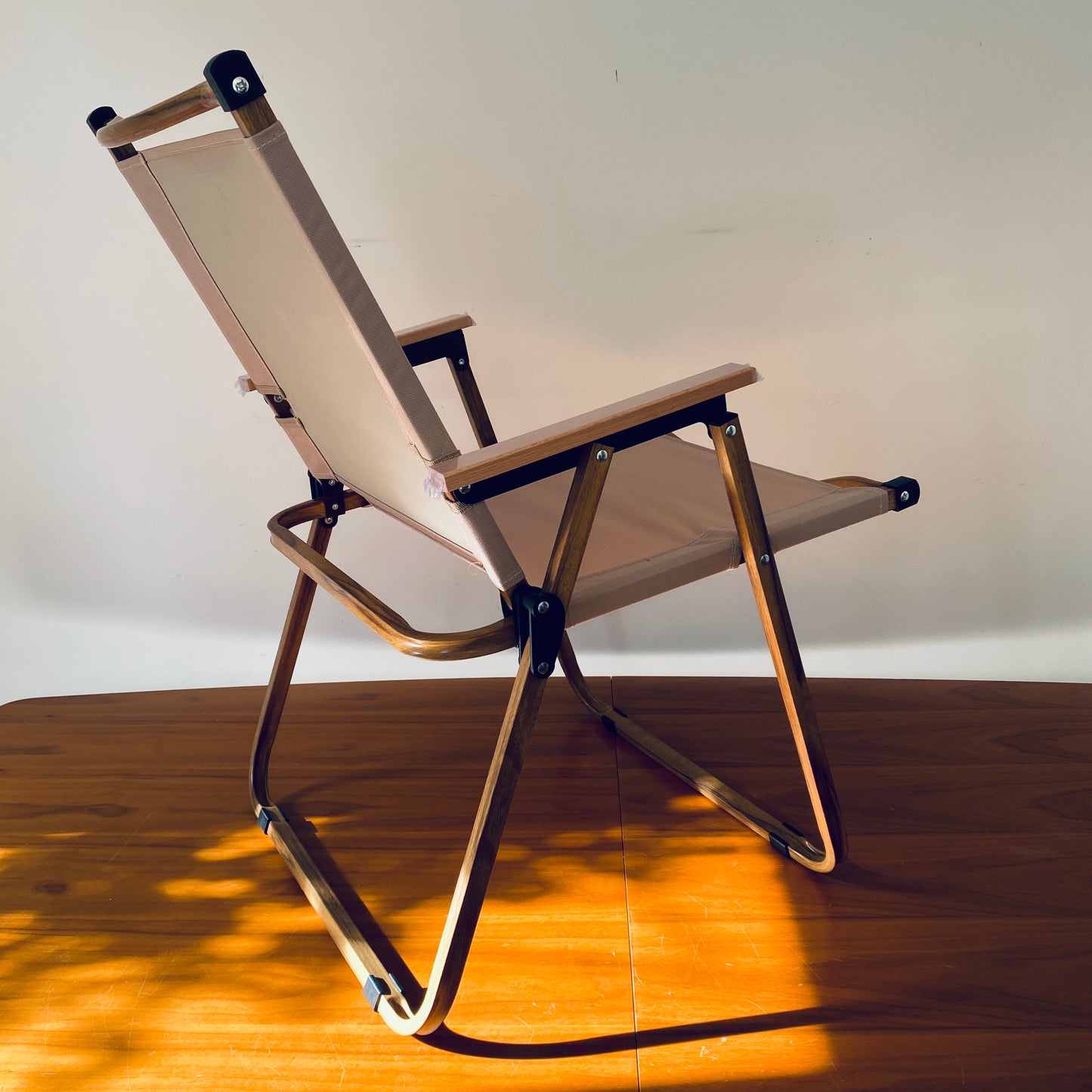 A back view of the foldable, portable, luxury safari chair by The Well Heeled Hippy